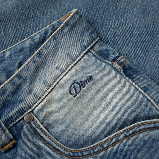 Sandblasted indigo Dime relaxed denim pants with faded wash, straight leg fit, and subtle embroidered branding.
