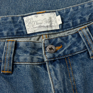 Sandblasted indigo Dime relaxed denim pants with faded wash, straight leg fit, and subtle embroidered branding.
