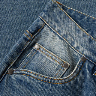 Sandblasted indigo Dime relaxed denim pants with faded wash, straight leg fit, and subtle embroidered branding.
