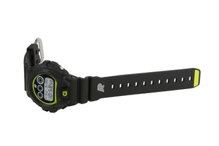 G-SHOCK DW6900AP23-1 watch with fluorescent yellow accents on face and strap, symbolizing durability and versatility.