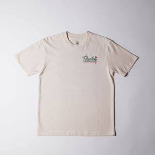 Drift House Birdies & Boardshorts Tee in Ecru, featuring a Space Coast golf benefit back graphic with surfboards, palm trees, and a rocket.