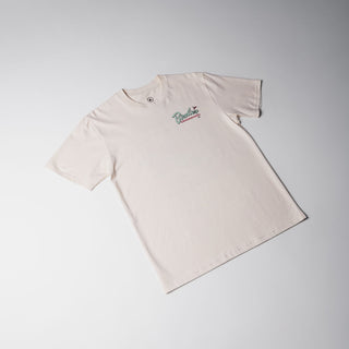 Drift House Birdies & Boardshorts Tee in Ecru, featuring a Space Coast golf benefit back graphic with surfboards, palm trees, and a rocket.