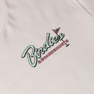 Drift House Birdies & Boardshorts Tee in Ecru, featuring a Space Coast golf benefit back graphic with surfboards, palm trees, and a rocket.