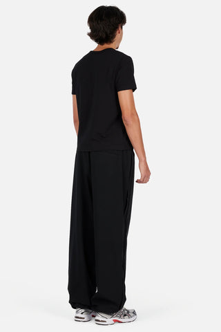 Dime Athletic Snap Pants in Black/Red — polyester/spandex blend with snap side seam plackets, integrated pockets, contrast mesh lining, 3M branding, cinched leg openings, and elasticated speckled drawstring waistband