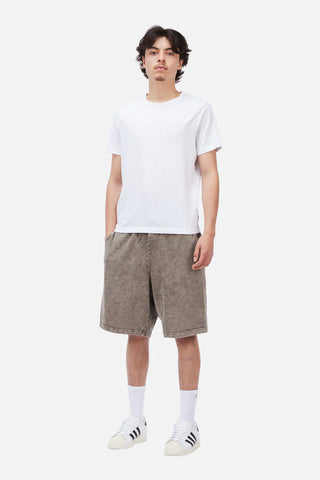 Person wearing a white t-shirt and brown shorts on a white background