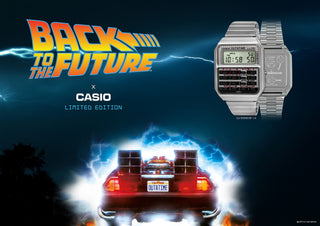 Casio Vintage CA500WEBF-1A Back to the Future edition watch with calculator design, silver case, and DeLorean-inspired detailing.