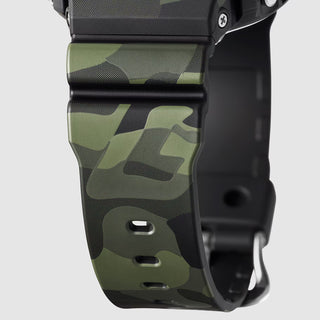 "G-Shock GM6900CMG-3 Bold Camo Gold Watch — gold-colored metal bezel, gold dial, camo printed band with hidden G-mark, classic 6900 silhouette"