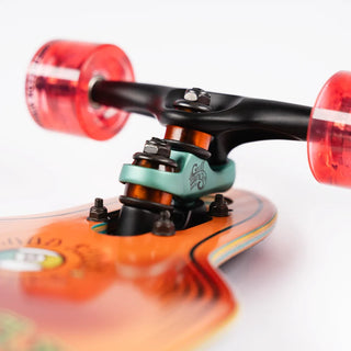 “End view of the Sector 9 9er Mini Fractal showing the layered maple deck, black Gullwing truck, and translucent red wheels.”