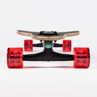 “End view of the Sector 9 9er Mini Fractal showing the layered maple deck, black Gullwing truck, and translucent red wheels.”