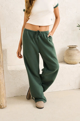 Rhythm Contrast Track Pant in Hunter, oversized trackpant with contrast stripe detail at sides, soft elastic waist with drawcord in a 51% cotton 49% polyester blend