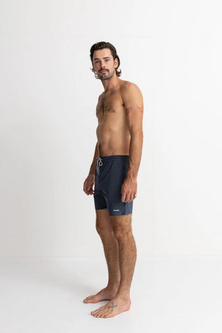 Navy recycled polyester beach shorts with mesh drainage pockets.