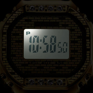 Digital clock display on a brick wall background