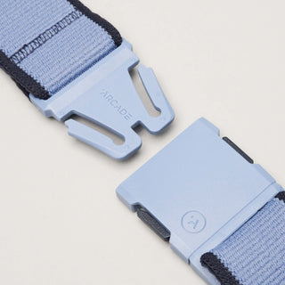 Arcade Carto Stretch Belt in Skye Navy with subtle color accents, contoured buckle, and REPREVE®️ recycled material.