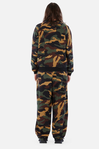 Front view of Dime Classic Logo Crewneck in Dark Camo with green, brown, tan, and black camouflage, a small light-colored embroidered chest logo, and black collar, cuffs, and hem
