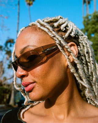 Crap Eyewear Speed Charm Sunglasses in Crystal Stone Bio/Earth — bioacetate wraparound frames with CR-39 lenses, 100% UVA/UVB protection, and spring hinges