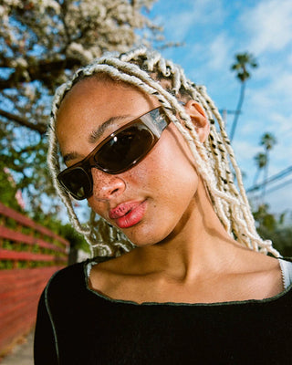 Crap Eyewear Speed Charm Sunglasses in Crystal Stone Bio/Earth — bioacetate wraparound frames with CR-39 lenses, 100% UVA/UVB protection, and spring hinges
