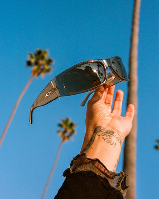 Crap Eyewear Speed Charm Sunglasses in Crystal Stone Bio/Earth — bioacetate wraparound frames with CR-39 lenses, 100% UVA/UVB protection, and spring hinges