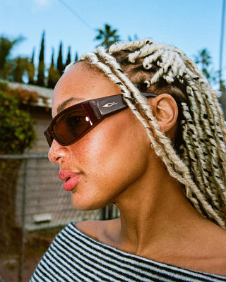 Crap Eyewear Speed Charm Sunglasses in Mahogany Bio/Cinnamon — bioacetate wraparound frames with CR-39 lenses, 100% UVA/UVB protection, and spring hinges