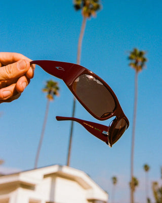 Crap Eyewear Speed Charm Sunglasses in Mahogany Bio/Cinnamon — bioacetate wraparound frames with CR-39 lenses, 100% UVA/UVB protection, and spring hinges