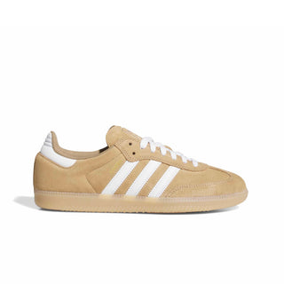 A classic low-top sneaker in beige suede with three white stripes on the side, white laces, and a beige rubber sole, shown from a side profile on a white background.