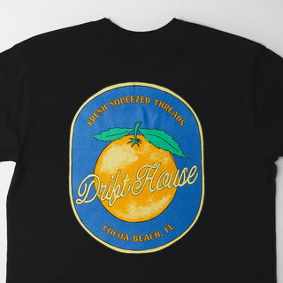 Drift House Fresh Squeezed Tee in Black — Florida orange front graphic and "Fresh Squeezed Threads" Cocoa Beach back print on a 100% combed cotton regular fit tee