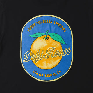 Drift House Fresh Squeezed Tee in Black — Florida orange front graphic and "Fresh Squeezed Threads" Cocoa Beach back print on a 100% combed cotton regular fit tee