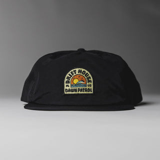 Black Drift House Dawn Patrol hat with sunrise wave patch and snapback.