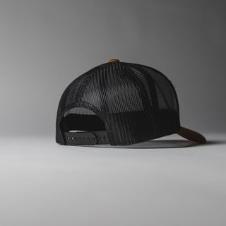Camel Drift House Hex trucker hat with mesh back and hex logo.