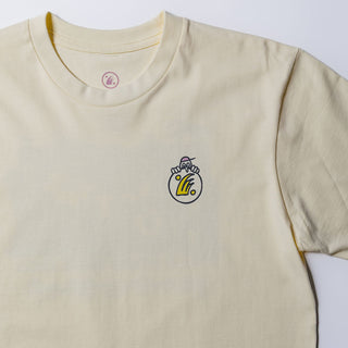 Drift House Good Time Tee in Butter with floral back print and Drift House logo on front.