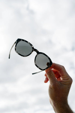 Otis Eyewear Offset Sport sunglasses in Matte Slate Tort with L.I.T Polar Grey mineral glass lenses, Italian-made Eco-Grilamid ultra-lightweight frame with increased pantoscopic tilt, subtle side blinders, integrated nose pads and temple tips, hand-painted finish, 52-20-127mm sizing