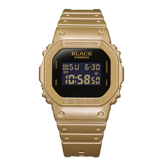 G-SHOCK DW5600BEP-9 BlackEyePatch watch with a gold-tone square case and band, black face, digital display, and BlackEyePatch branding