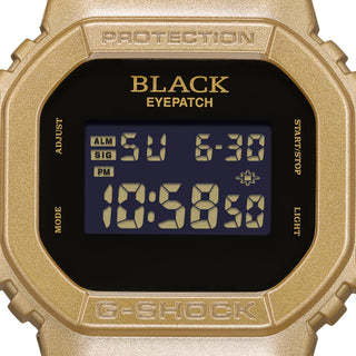 G-SHOCK DW5600BEP-9 BlackEyePatch watch with a gold-tone square case and band, black face, digital display, and BlackEyePatch branding