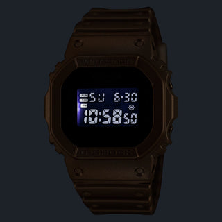 G-SHOCK DW5600BEP-9 BlackEyePatch watch with a gold-tone square case and band, black face, digital display, and BlackEyePatch branding