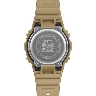 G-SHOCK DW5600BEP-9 BlackEyePatch watch with a gold-tone square case and band, black face, digital display, and BlackEyePatch branding