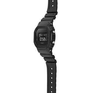 Black digital watch with a white background
