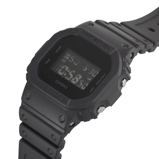 Black Casio digital watch on a white background