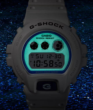G-SHOCK DW-6900HDS-7 in white with glowing blue face and marine-inspired details.