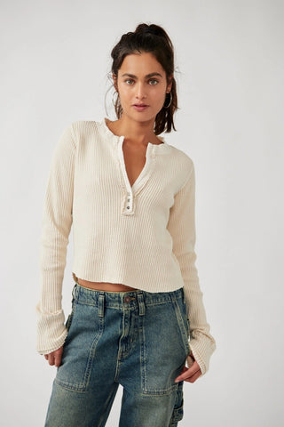 Henley-style waffle-knit Free People Colt Top with distressed hems.
