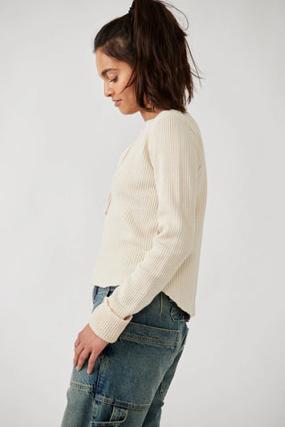 Henley-style waffle-knit Free People Colt Top with distressed hems.