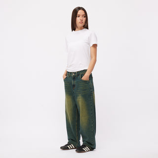 Dime Baggy Denim Pants in Sandblasted Pine with wavy back pockets and embroidered logos.