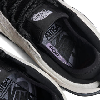 Vans Skate Safe Low Atiba in bone white and black with suede upper, PopCush cushioning, and DuraCap reinforcements.
