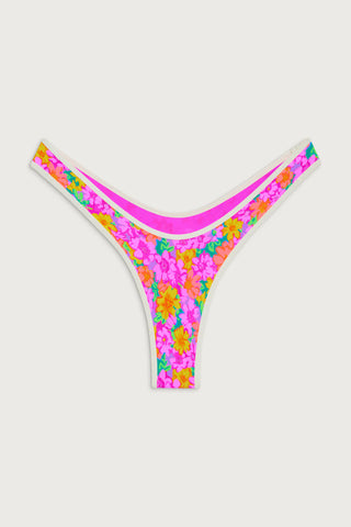 Vintage-inspired micro bikini bottom with neon floral print and high-leg cut by Frankies Bikinis.Vintage-inspired micro bikini bottom with neon floral print and high-leg cut by Frankies Bikinis.
