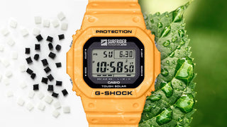 Orange Casio G-Shock watch with digital display on a green and white background