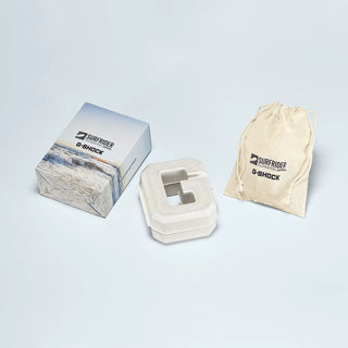 G-Shock watch case with packaging and drawstring bag on a light gray background