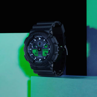 G-SHOCK GA100BEG-1A analog-digital watch with black resin case, electro green accents, and oversized dial.