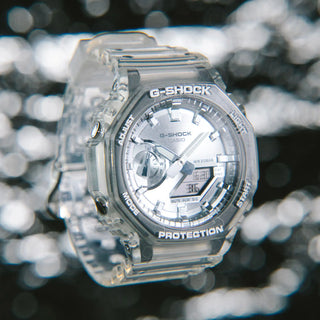 Clear G-Shock watch with a blurred background
