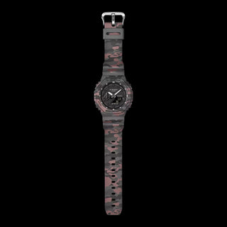Casio G-Shock GA2100CM-8A camo watch with metallic camouflage pattern and octagonal case design.
