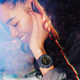 Casio G-Shock GA2100K-2A watch with black glossy dial, neon accents, and octagonal case design.