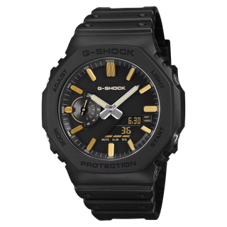 G-SHOCK GA-2100LXB-1A9 Watch in Brown/Gold — CasiOak silhouette with carbon core guard structure, gold IP stainless steel bezel, gold-tone accents, analog-digital display, 200M water resistant