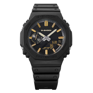 G-SHOCK GA-2100LXB-1A9 Watch in Brown/Gold — CasiOak silhouette with carbon core guard structure, gold IP stainless steel bezel, gold-tone accents, analog-digital display, 200M water resistant